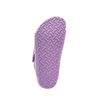 Purple children's sandal sole with textured tread pattern, bottom view