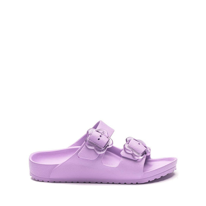 Light purple slip-on sandals with two adjustable buckle straps, side view