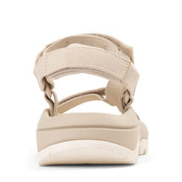 Light beige sport sandal with adjustable straps and cushioned sole, rear view