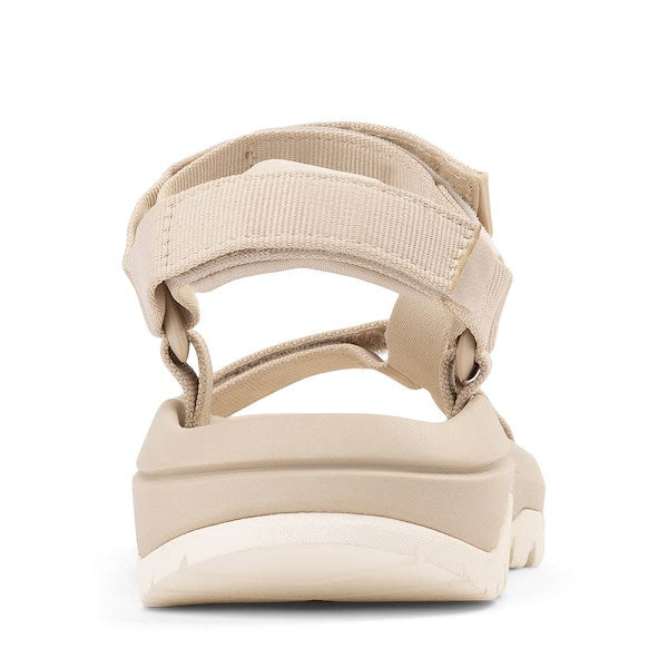 Light beige sport sandal with adjustable straps and cushioned sole, rear view