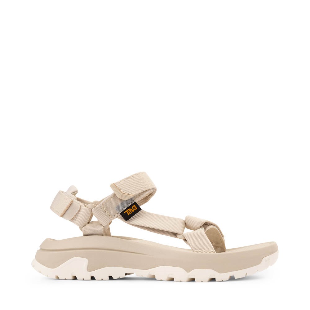 Beige sport sandal with adjustable straps and chunky treaded sole, side view