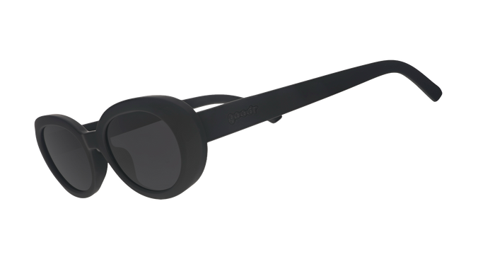 Black oversized round sunglasses with thick frames shown at three-quarter angle