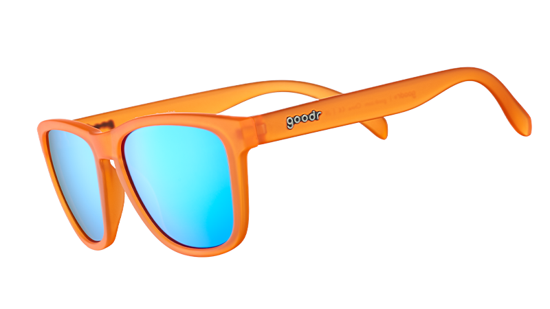 Orange sunglasses with blue mirrored lenses shown from side angle on white background
