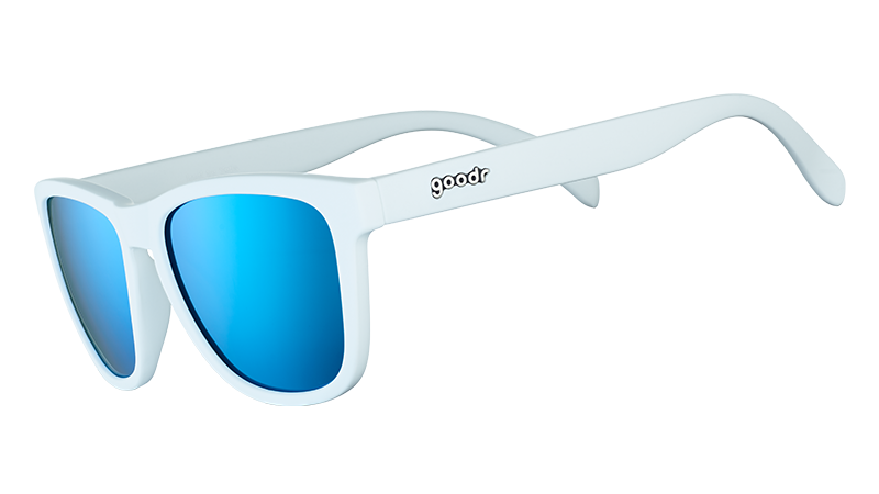 Light blue sunglasses with blue polarized lenses shown from side angle on transparent background