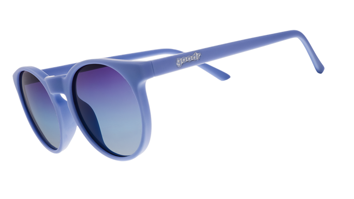 Round oversized sunglasses in periwinkle blue frame with gradient purple-blue lenses, side angle view