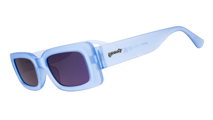 Light blue translucent sunglasses with dark gradient lenses shown in side profile view