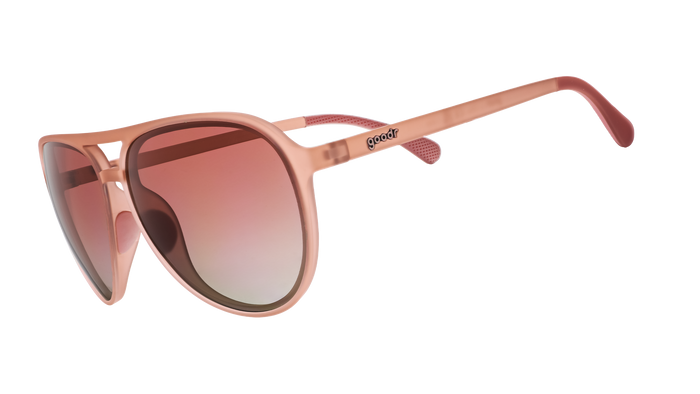 Pink aviator-style sunglasses with gradient lenses shown in side profile view