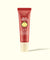 Red tinted lip balm tube with SPF 30 protection, coconut scent, front view