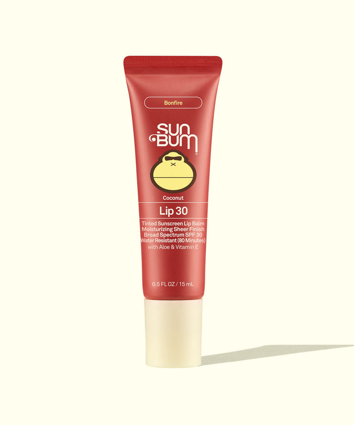 Red tinted lip balm tube with SPF 30 protection, coconut scent, front view