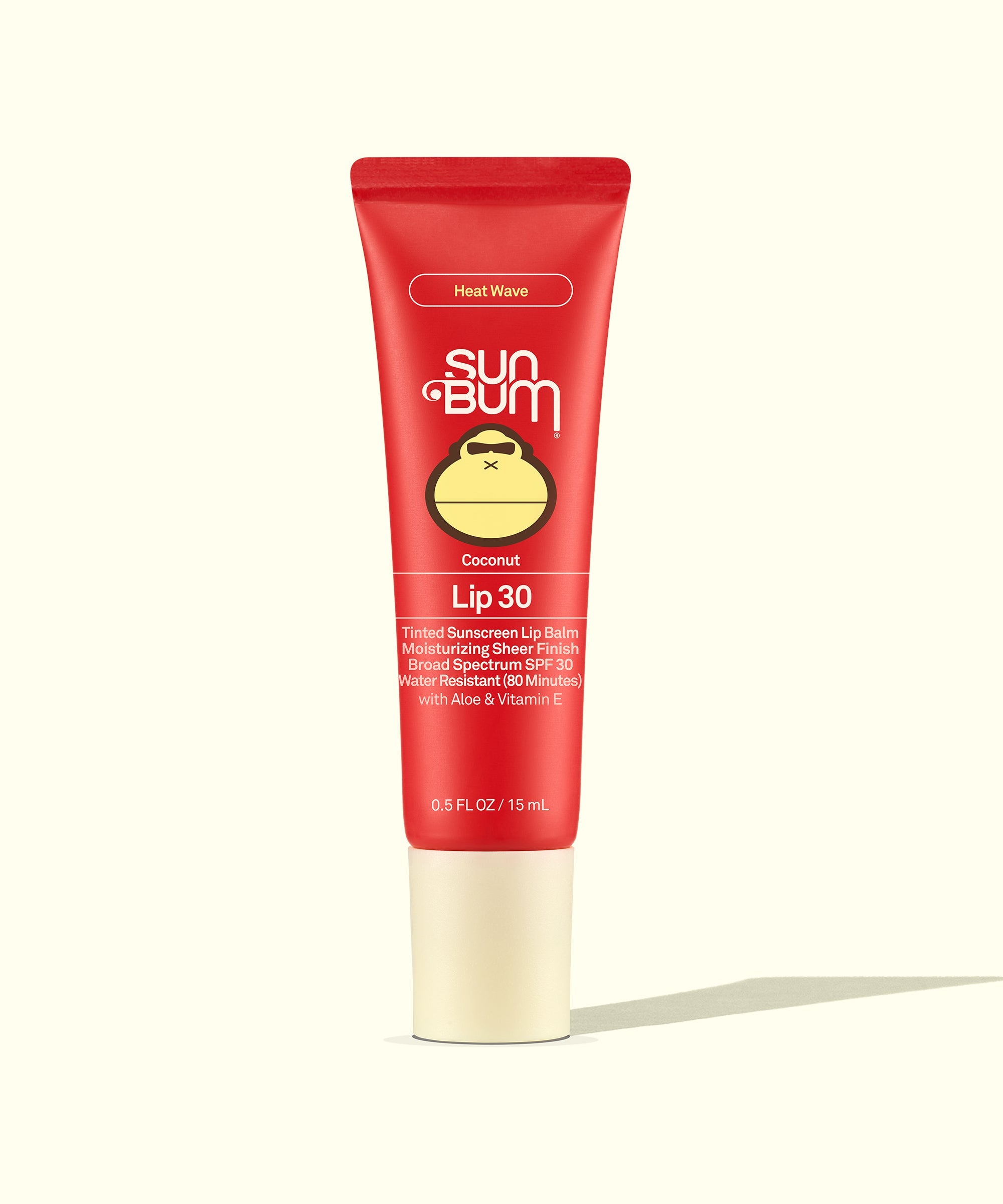 Red tinted sunscreen lip balm tube with SPF 30 protection in coconut scent