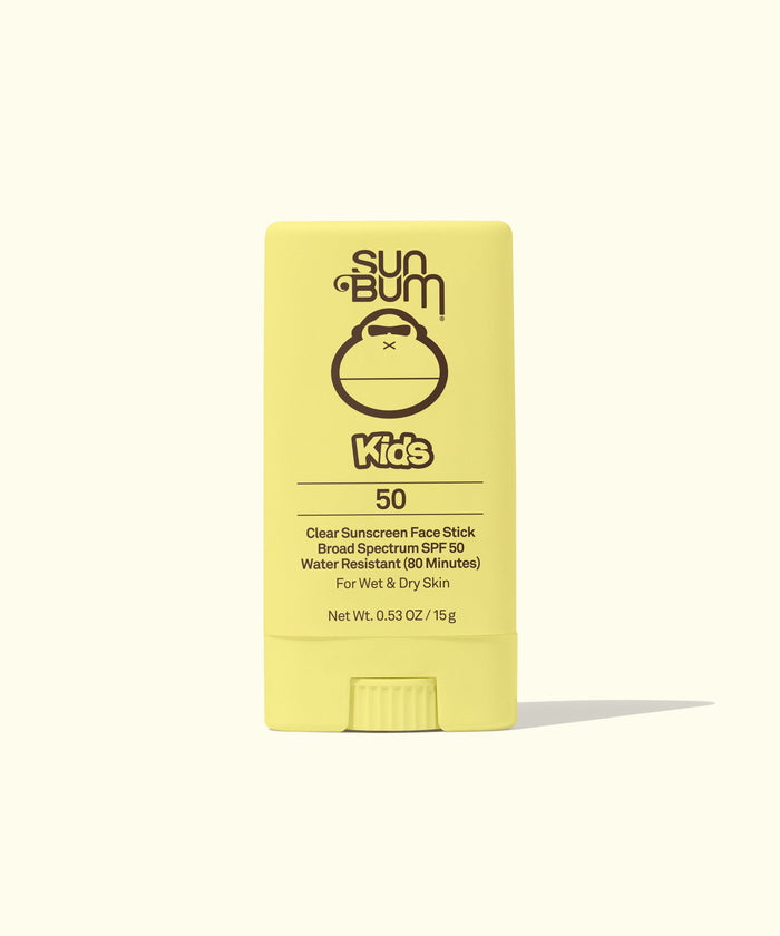 Yellow sunscreen stick with SPF 50 protection, standing upright on clean background