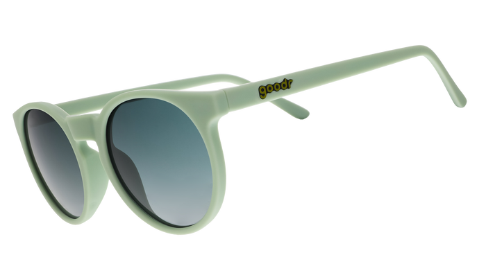 Light green round-frame sunglasses with gradient lenses shown at three-quarter angle