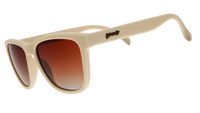 Cream colored oversized sunglasses with brown gradient lenses shown from side angle