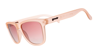 Translucent peachy-pink sunglasses with oversized square frames and gradient rose-tinted lenses