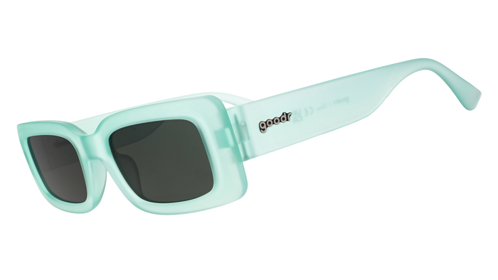 Mint green rectangular sunglasses with dark lenses shown in side profile view