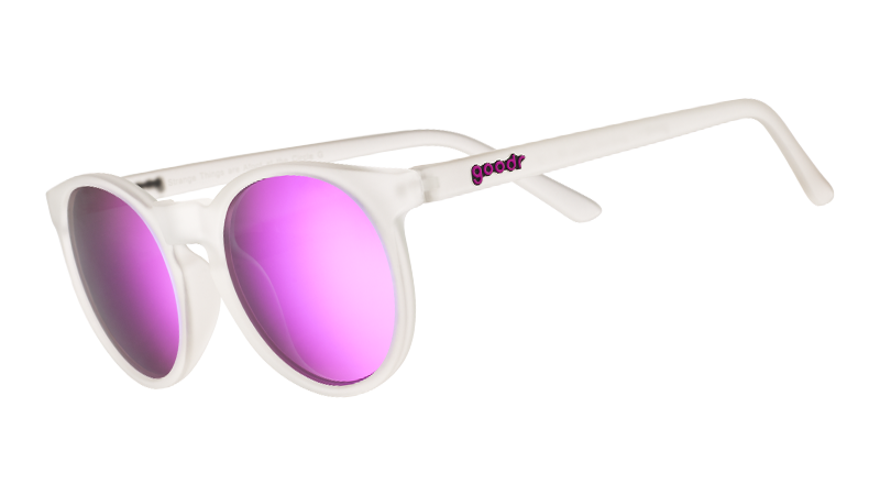 Clear frame sunglasses with purple mirrored lenses shown at three-quarter angle