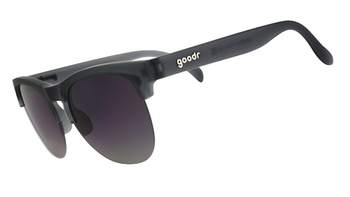Gray semi-rimless sunglasses with gradient purple lenses shown from side angle
