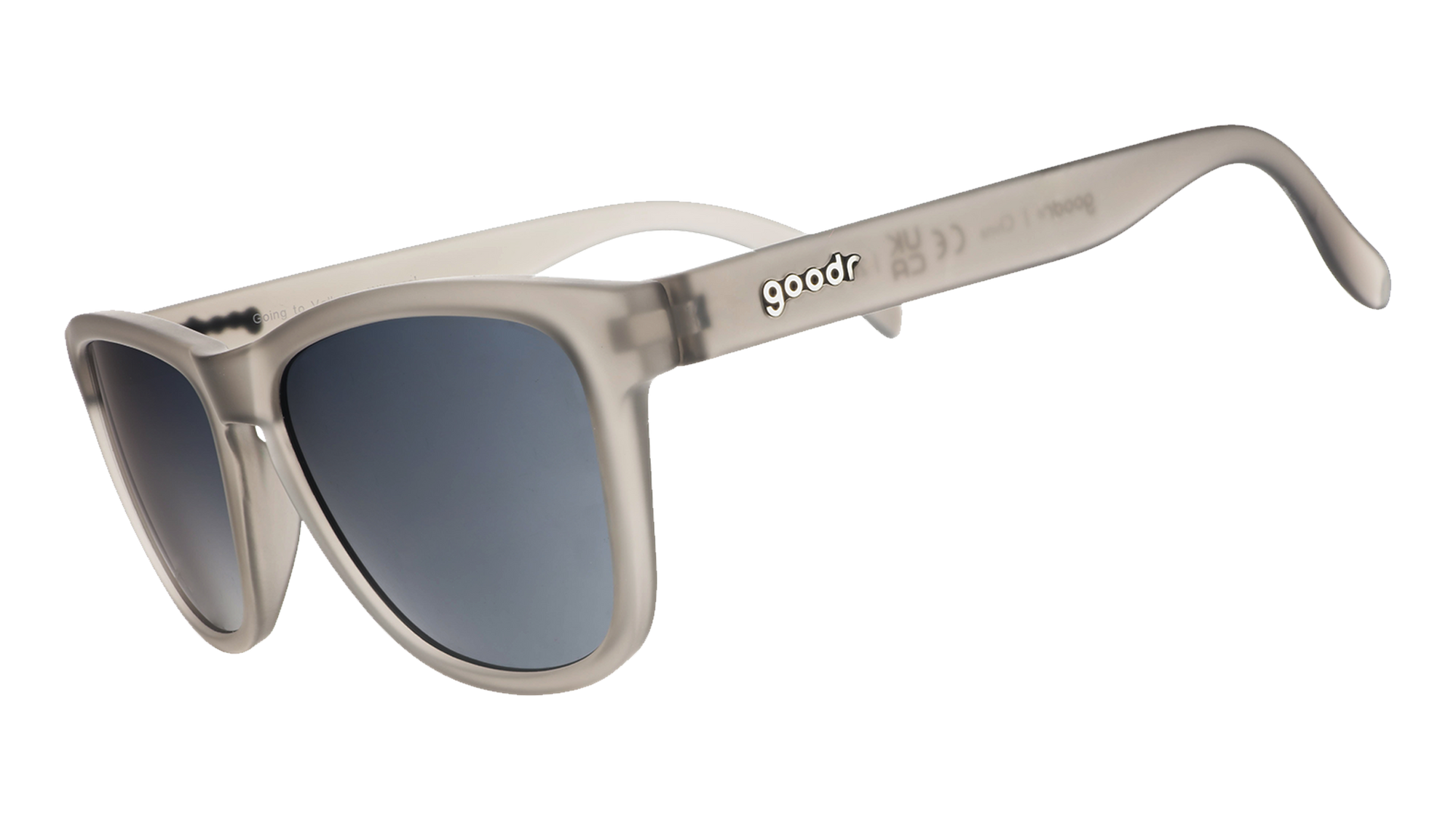 Translucent beige sunglasses with gradient lenses shown from side angle on white background