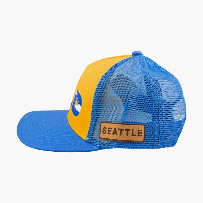 Gold and blue trucker snapback cap with mesh back, Seattle leather patch, side view