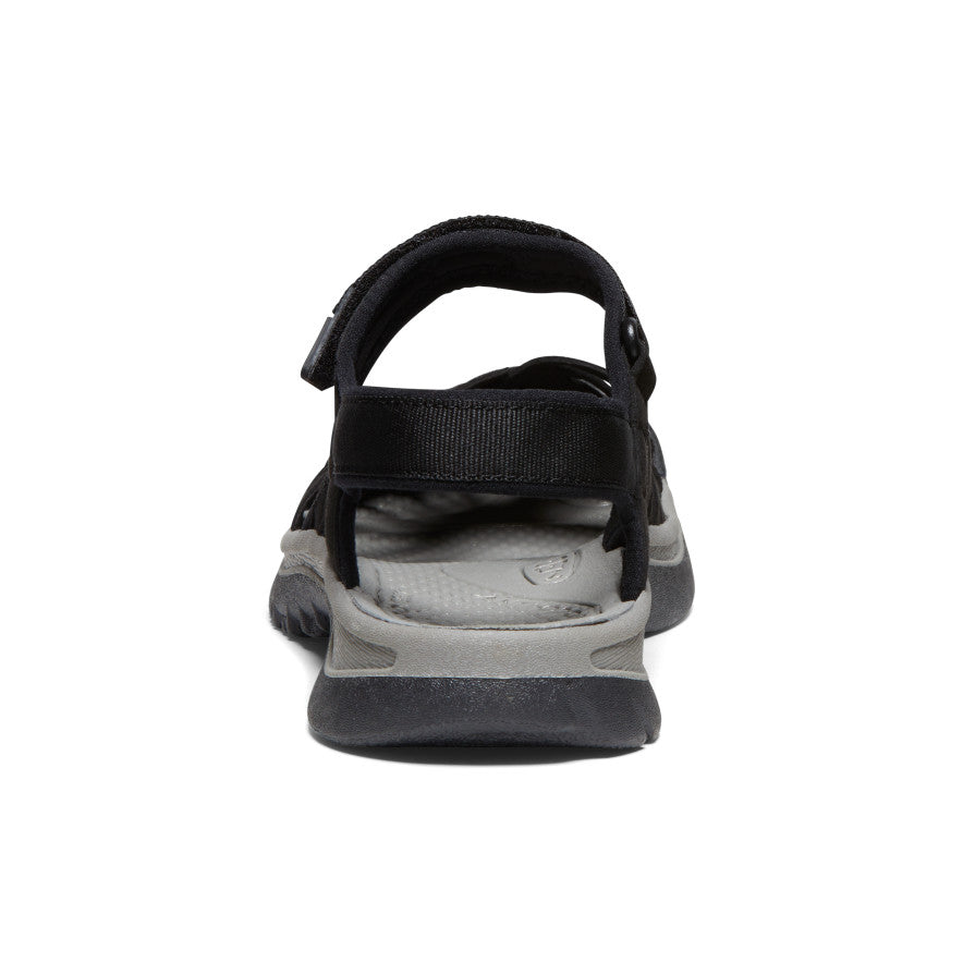 Black sports sandal with adjustable straps and gray sole, rear view