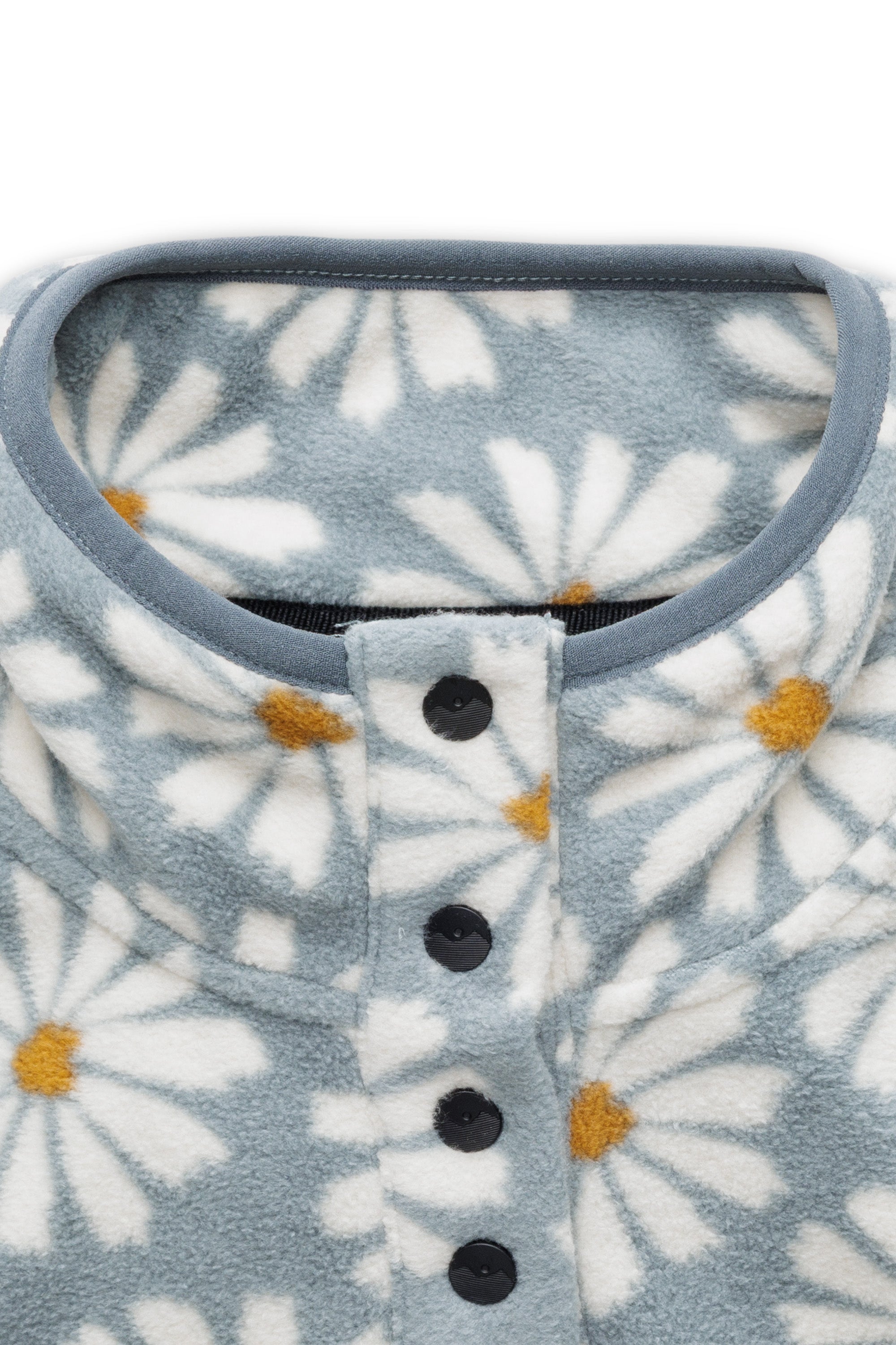 Light blue fleece pullover with white daisy print and snap button closure