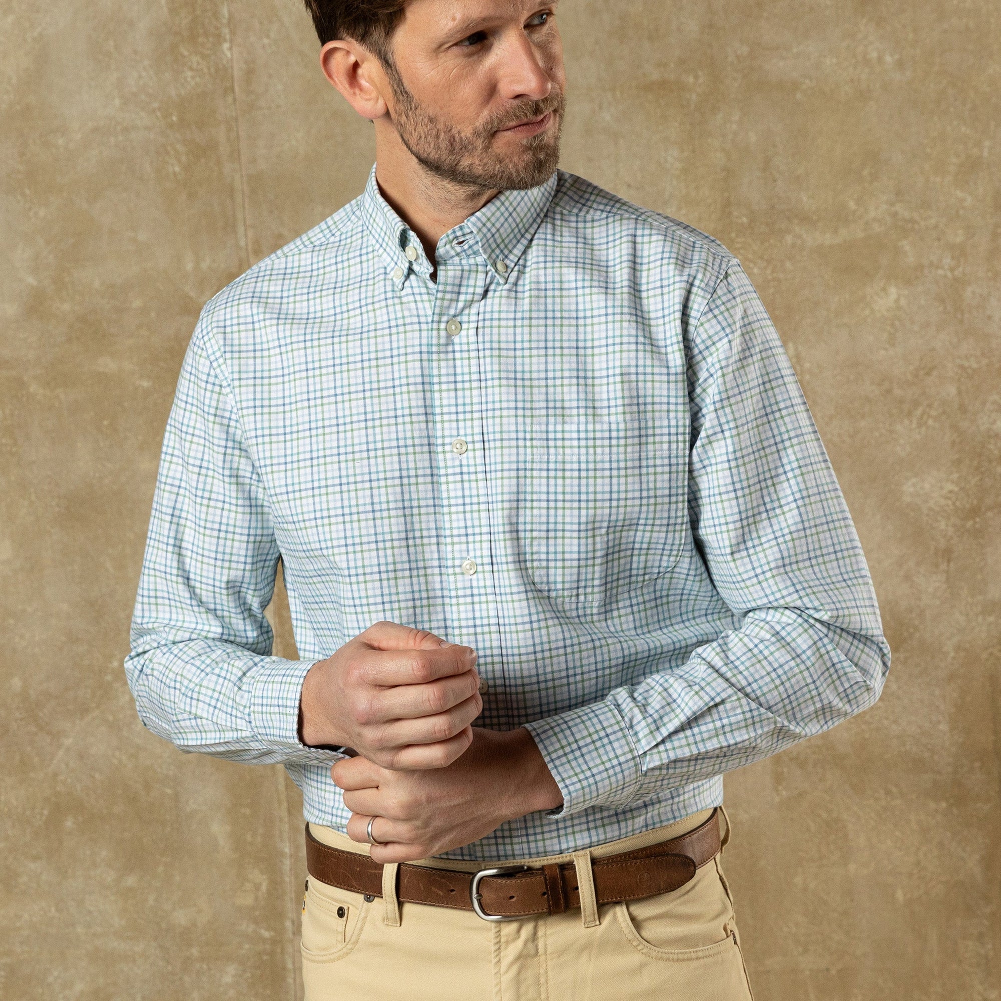Men's long sleeve button-down shirt in light blue and green check pattern, front view