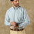 Men's long sleeve button-down shirt in light blue and green check pattern, front view