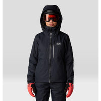 Women's insulated ski jacket in black, front view, with hood, goggles, and red gloves