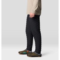 Black quilted insulated men's pants with side pocket, shown from side angle on model