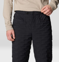 Black quilted insulated pants with elastic waistband and buckle closure, front detail view