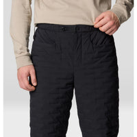 Black quilted insulated pants with elastic waistband and buckle closure, front detail view