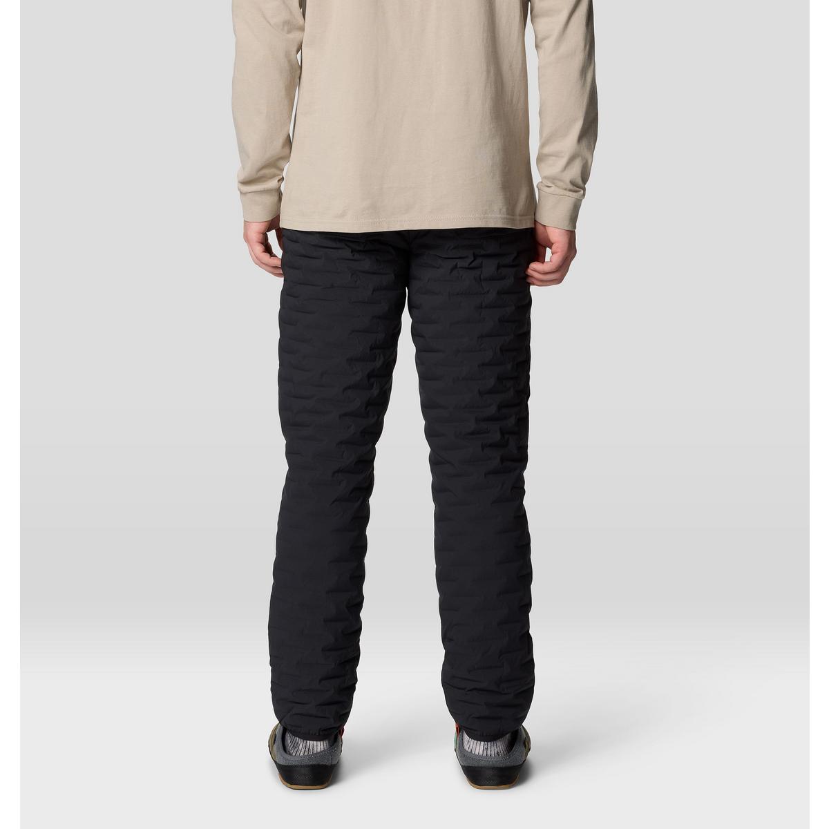 Black quilted insulated men's pants, back view, shown on model with casual shoes