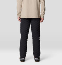 Black quilted insulated pants, back view on male model, horizontal baffle stitching detail