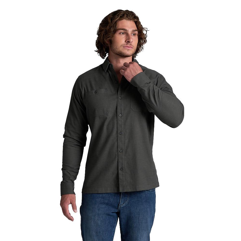 Men's long-sleeve button-up flannel shirt in dark charcoal, front view on model