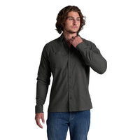Men's long-sleeve button-up flannel shirt in dark charcoal, front view on model