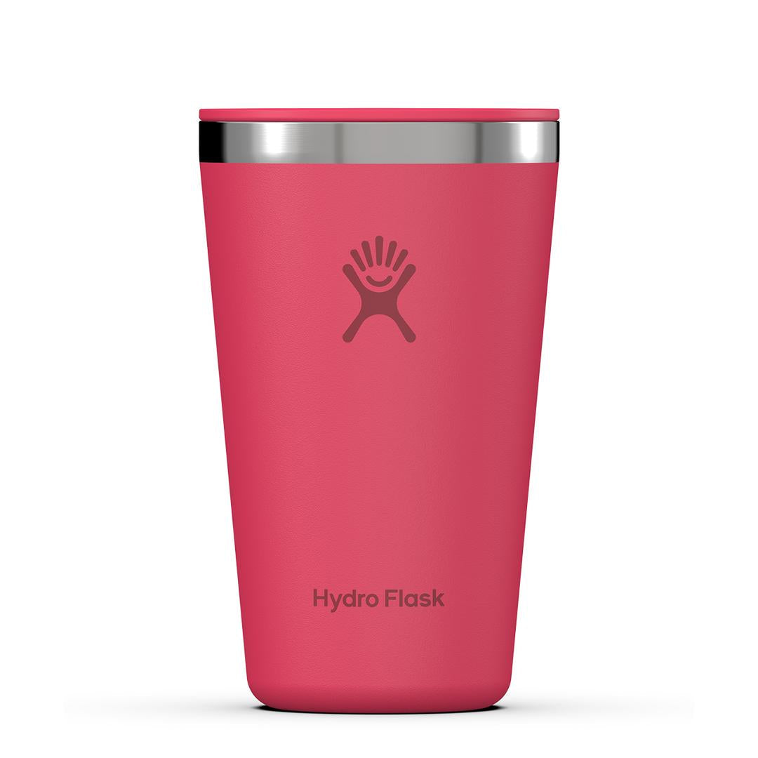 Coral pink insulated stainless steel tumbler with silver rim, front view
