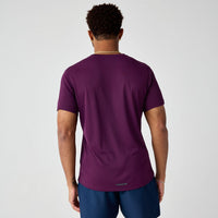 Deep purple athletic short sleeve shirt shown from back view on male model