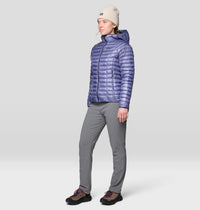 Women's slim-fit gray hiking pants shown on model with puffer jacket, front three-quarter view