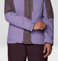 Close-up detail of women's ski jacket sleeve with velcro cuff and Dryspell branding, two-tone purple colorblock