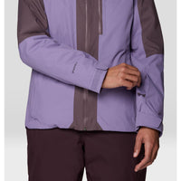 Close-up of a two-tone purple waterproof jacket with velcro cuff closure and front zip, on model