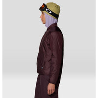 Women's insulated jacket in dark plum, side view, with Oakley goggles and beanie
