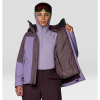 Women's ski jacket open to show insulated lining, worn with base layer, goggles, and hood