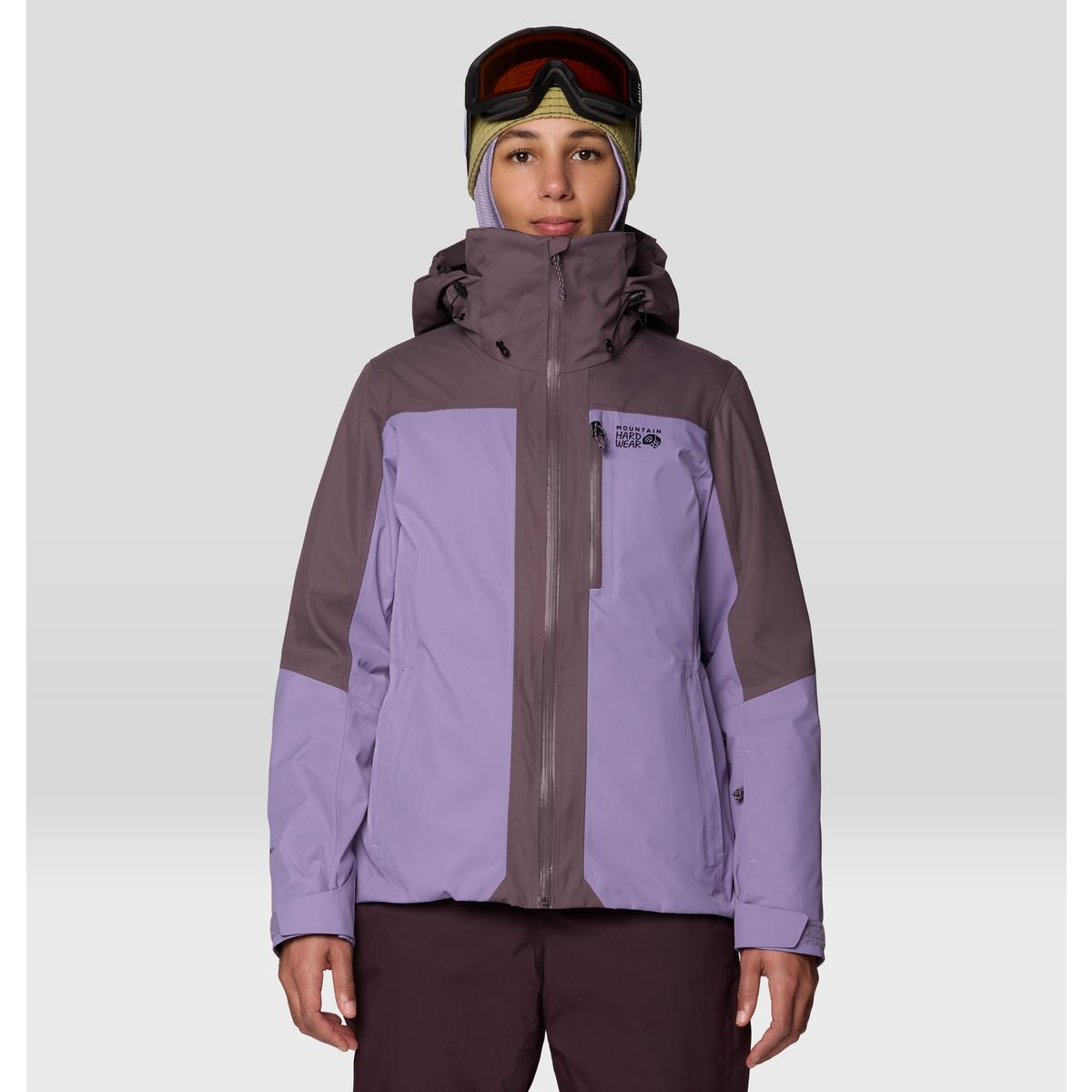Women's ski jacket in two-tone purple with hood, full zip, and chest pocket, front view on model