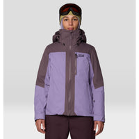 Women's ski jacket in two-tone purple with hood, full zip, and chest pocket, front view on model