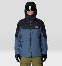 Men's hooded ski jacket in blue and black colorblock, front view, with ski goggles and gloves