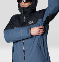 Men's ski jacket with two-tone blue and black colorblock design, hood up, detail close-up view