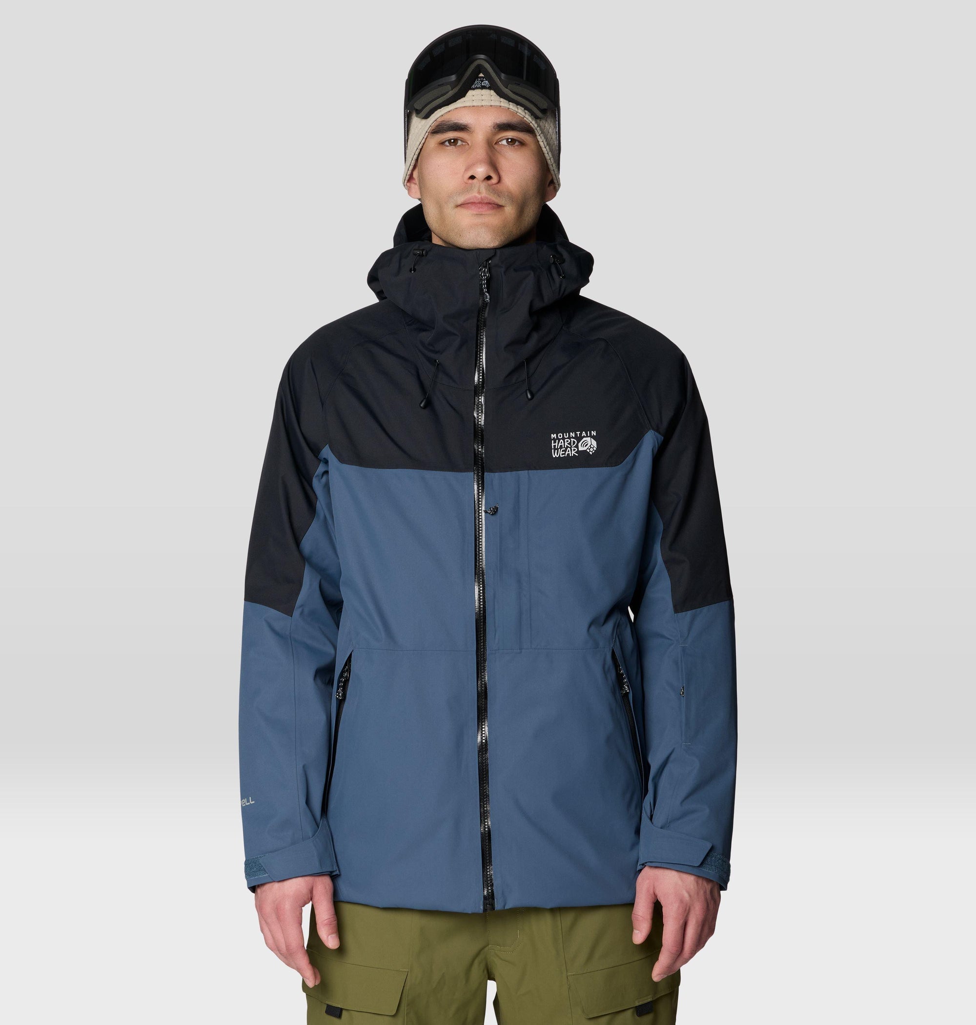 Men's hooded shell jacket in two-tone blue and black colorblock, front view on model
