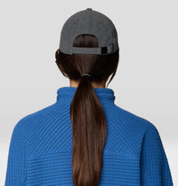 Corduroy baseball cap in dark gray, back view showing adjustable strap and ponytail opening