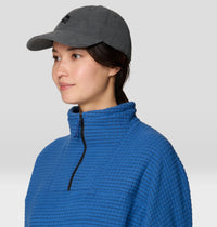 Dark gray corduroy baseball cap with curved brim, worn on model, side angle view