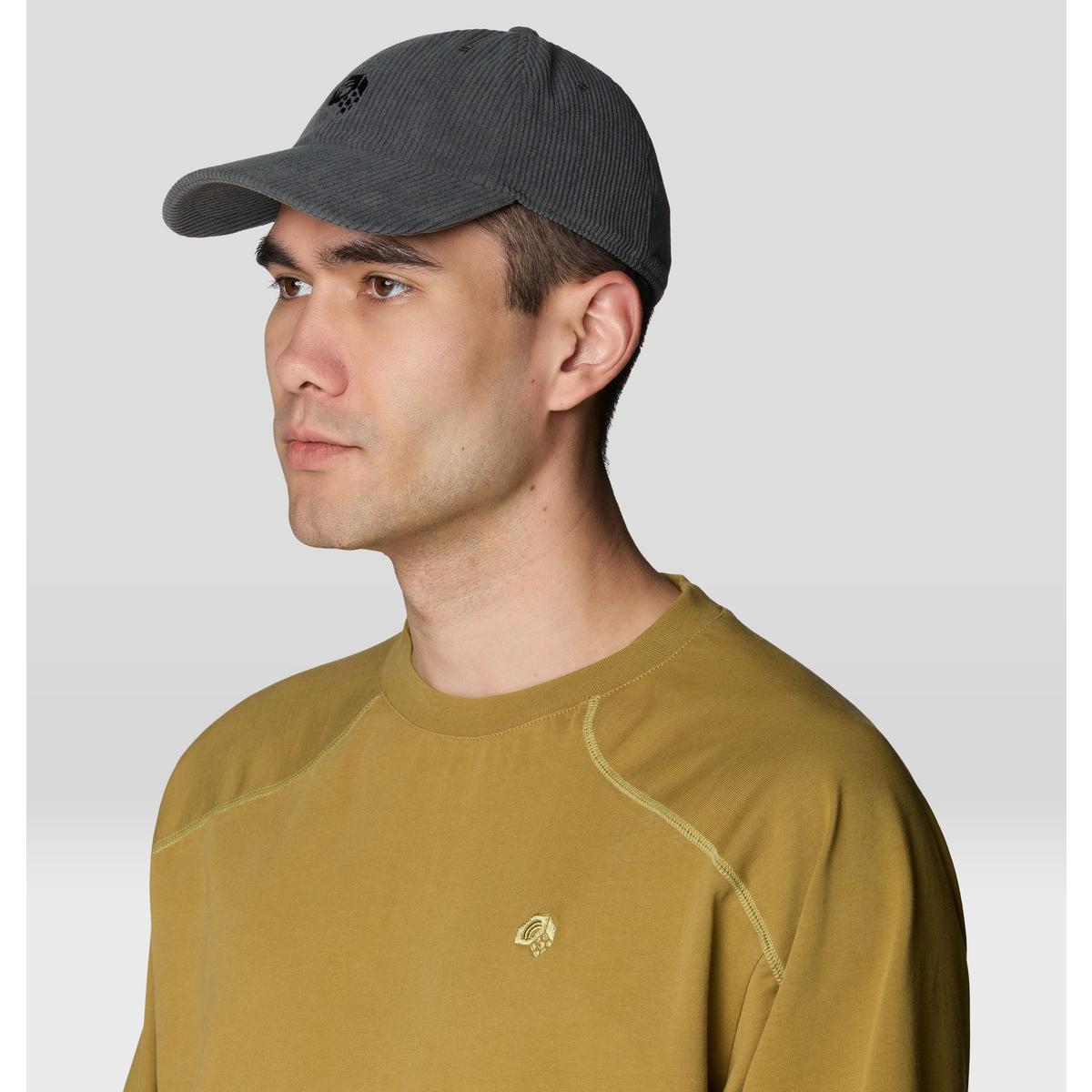 Dark gray corduroy baseball cap worn by male model, side profile view